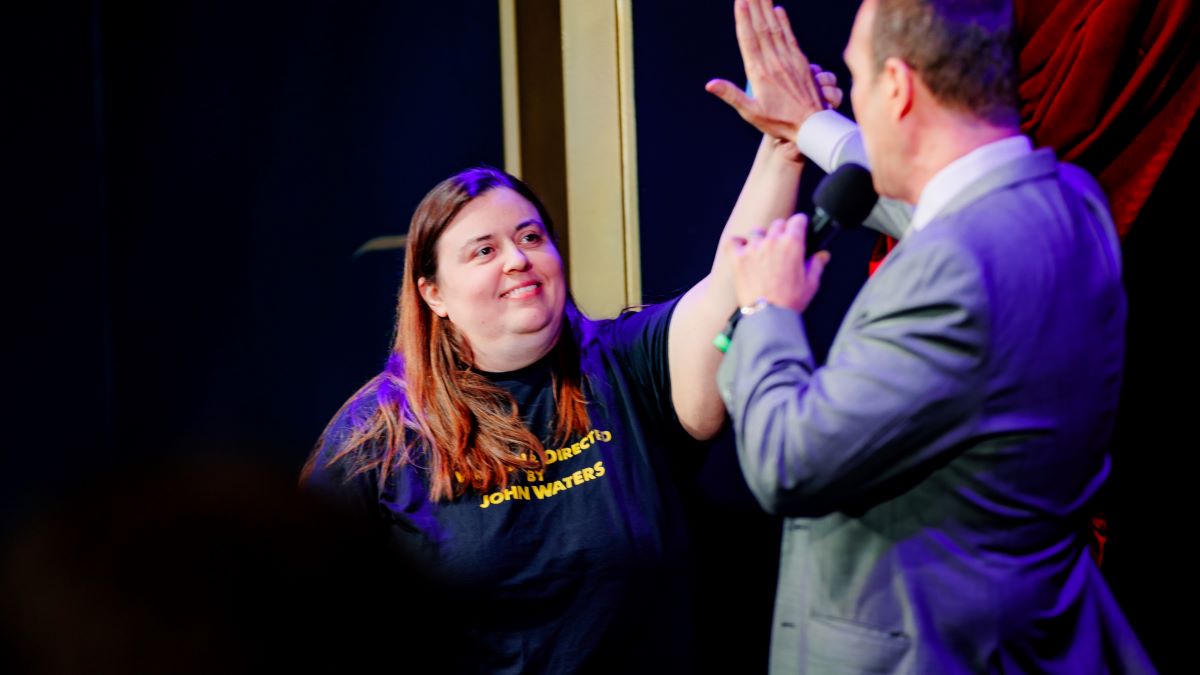 Christopher Carter interacting with audience members after a keynote