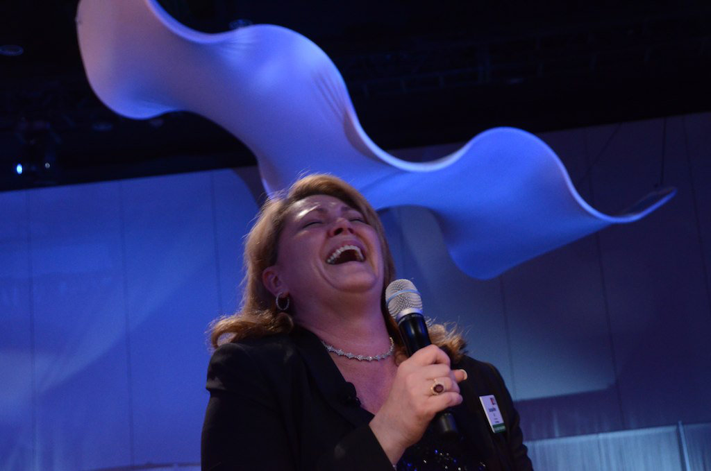 woman laughing at after dinner corprate entertainment